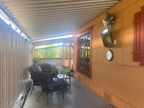 a dining room with furniture and a window