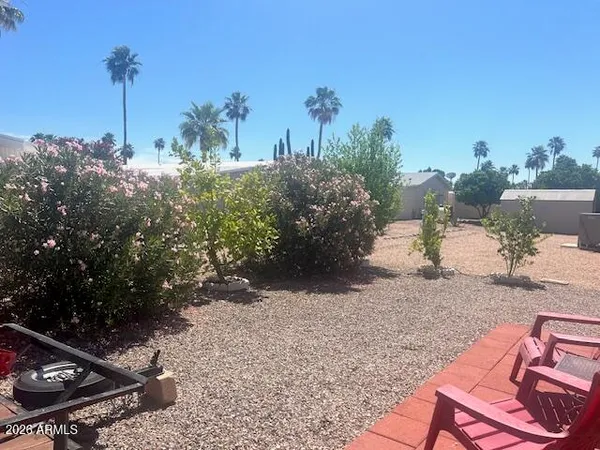a view of a backyard of the house