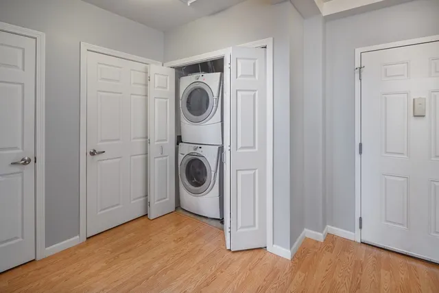 a view of a storage & utility room with dryer and washer