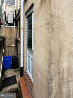 a bathroom with a shower and a mirror
