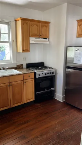 a kitchen with a stove and a microwave