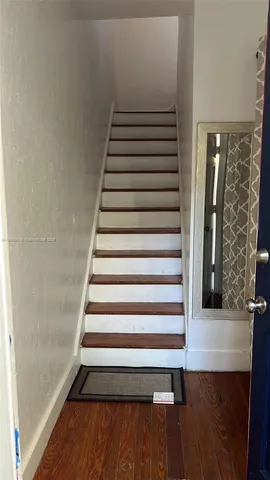 a view of entryway with wooden floor