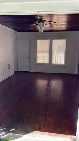 a view of front door and wooden floor