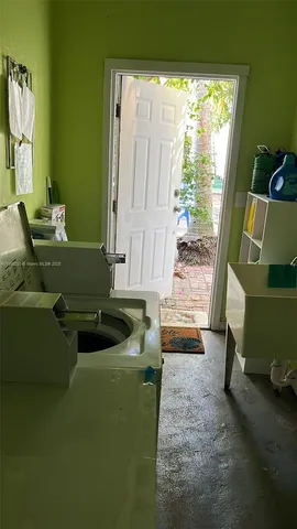a view of a workspace with furniture and a couch
