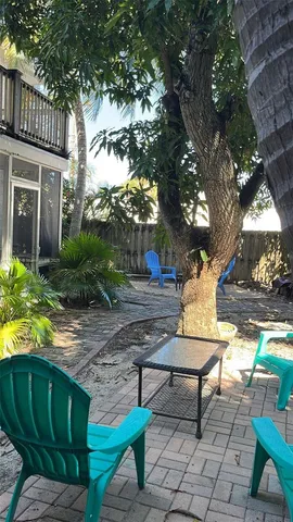 a view of a house with a tree in front