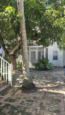 a view of a car park in front of a house