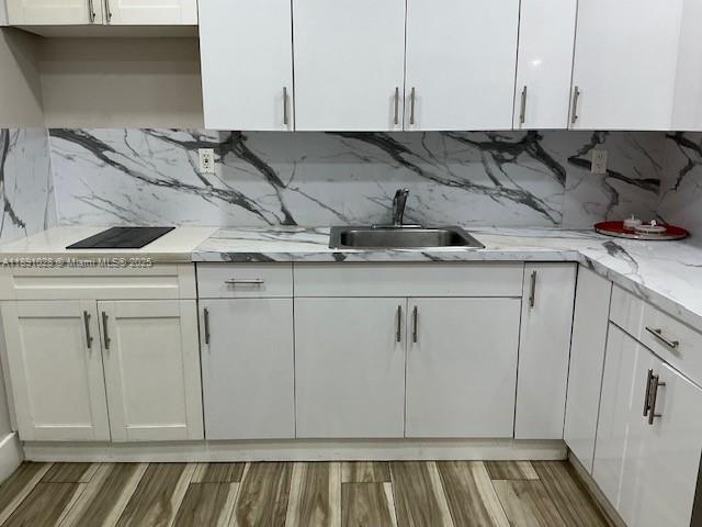 922 Northwest 2nd Street, Unit 1 Miami, FL 33128 - Photo 17 of 26 a view of a kitchen sink