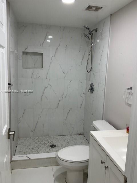 922 Northwest 2nd Street, Unit 1 Miami, FL 33128 - Photo 19 of 26 a bathroom with a sink a toilet and shower