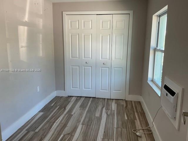 922 Northwest 2nd Street, Unit 1 Miami, FL 33128 - Photo 25 of 26 a view of room with hardwood floor