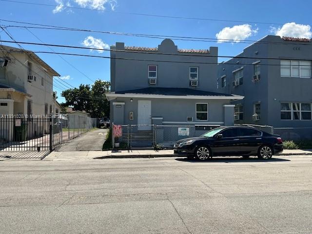 922 Northwest 2nd Street, Unit 1 Miami, FL 33128 - Photo 26 of 26 a car parked in front of a building