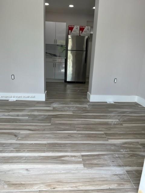 922 Northwest 2nd Street, Unit 1 Miami, FL 33128 - Photo 10 of 26 a view of a room with wooden floor