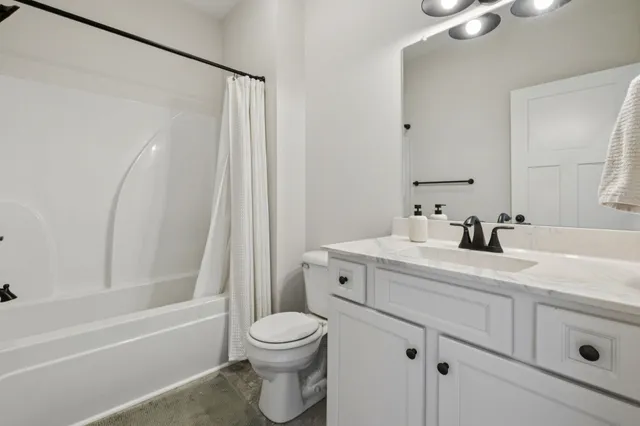 a bathroom with a sink a toilet and a bathtub