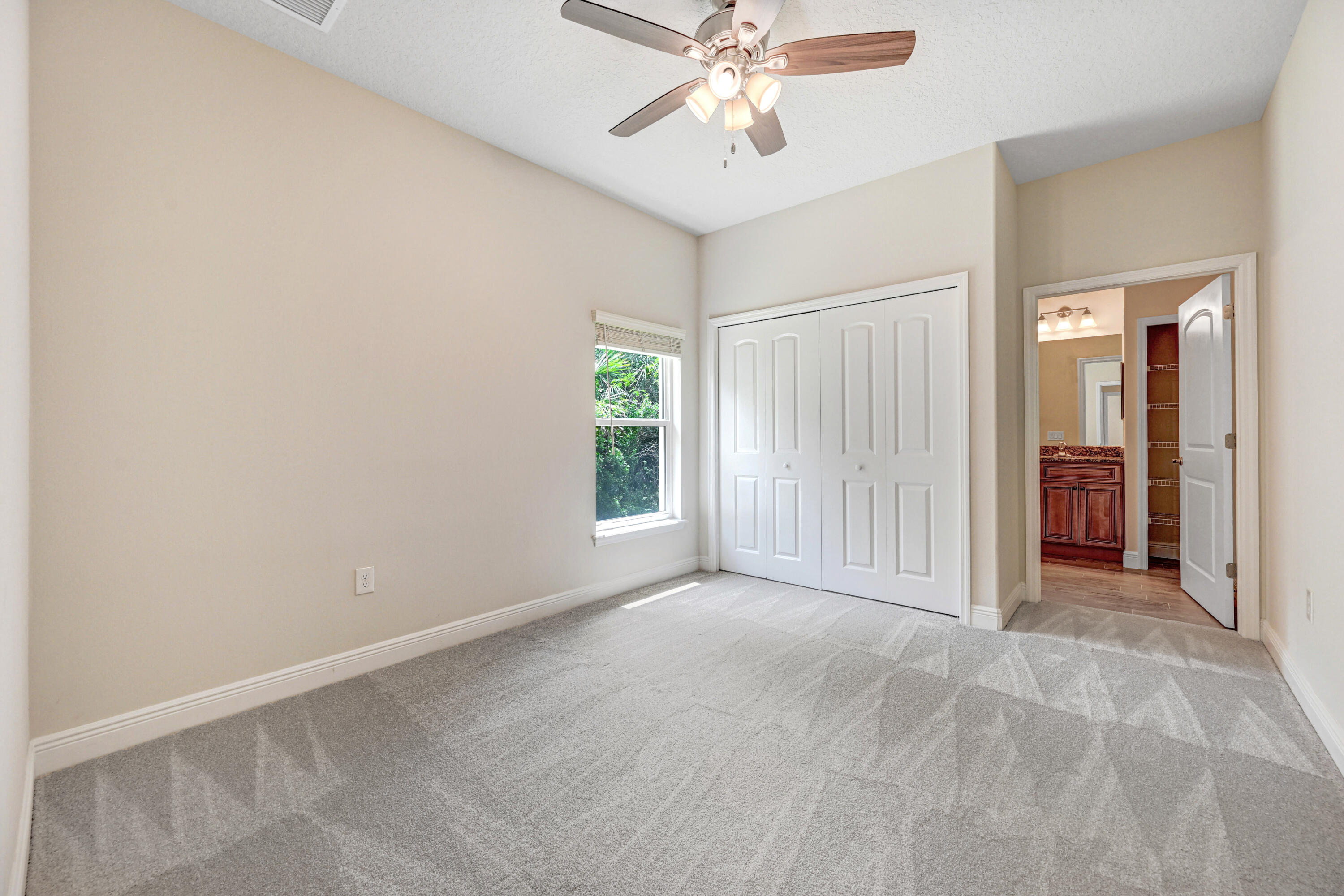 2690 Weber Road Malabar, FL 32950 - Photo 29 of 60 an empty room with windows and fan