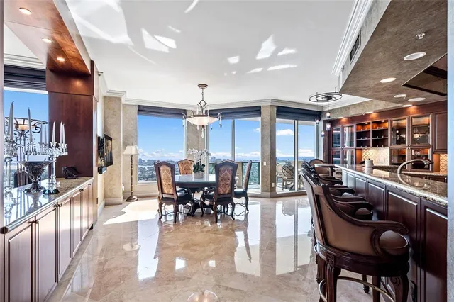 a view of a dining room with furniture window and outside view