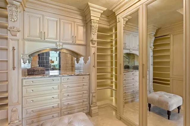 a view of a living room with a mirror and a table