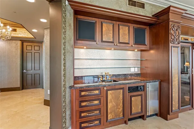 a living room with furniture and a book shelf
