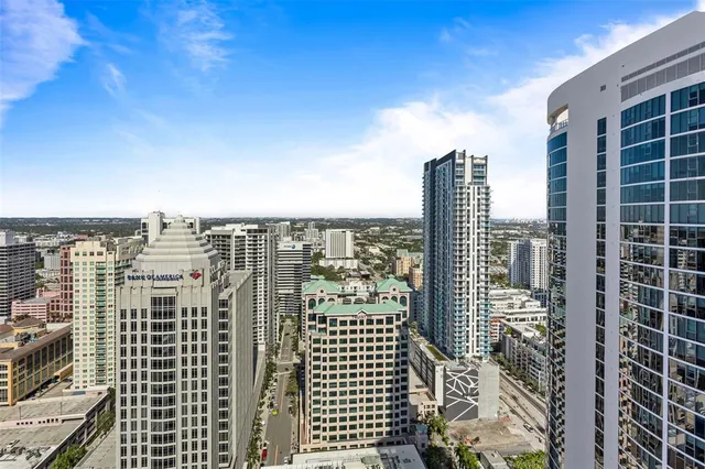 a view of a roof deck with furniture