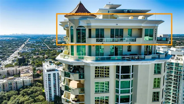 a view of a balcony with chair and table