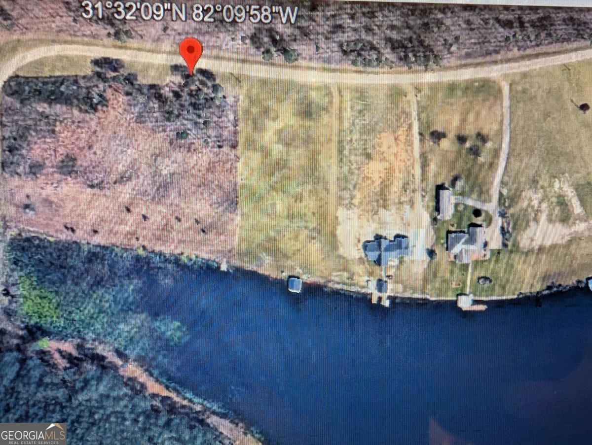 0 Jimmy Ree Lane Bristol, GA 31518 - Photo 4 of 7 a room with water heater and wooden floor