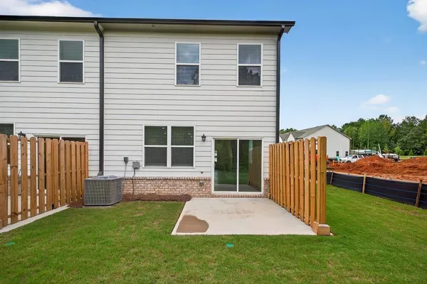 a front view of house with deck and yard