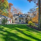 a view of a house with a backyard