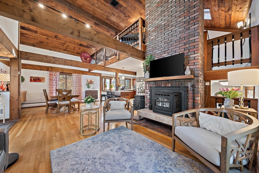 24 Pammys Path Easton, MA 02356 - Photo 13 of 39 a living room with furniture and a fireplace