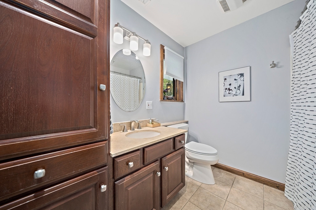 24 Pammys Path Easton, MA 02356 - Photo 22 of 39 a bathroom with a sink a toilet and mirror