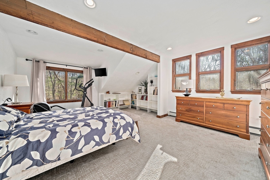 24 Pammys Path Easton, MA 02356 - Photo 27 of 39 a bedroom with a bed and large windows