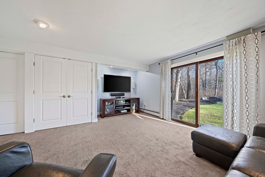 24 Pammys Path Easton, MA 02356 - Photo 29 of 39 a living room with furniture and a flat screen tv