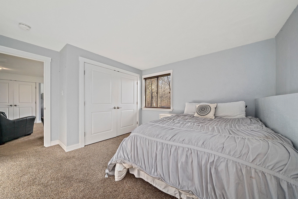 24 Pammys Path Easton, MA 02356 - Photo 32 of 39 a bedroom with a bed and a window