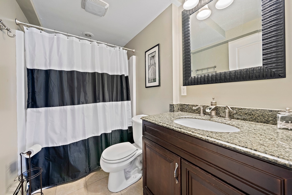 24 Pammys Path Easton, MA 02356 - Photo 33 of 39 a bathroom with a granite countertop bathtub sink vanity mirror and toilet