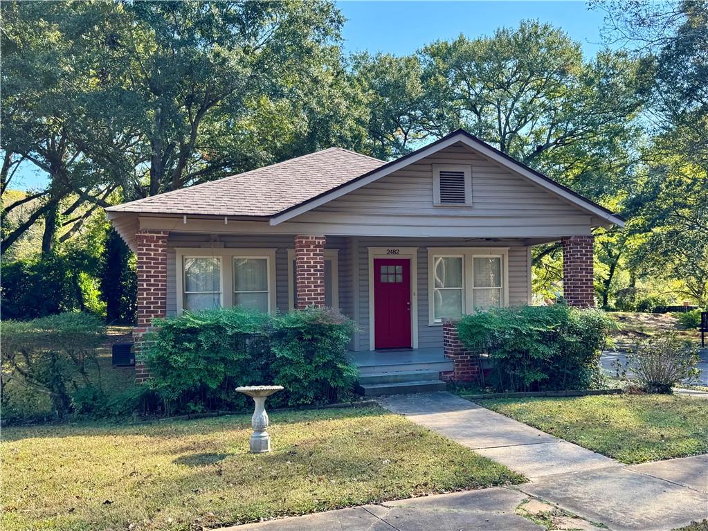 2482 Maple Street East Point, GA 30344 - Photo 1 of 39 a front view of a house with garden