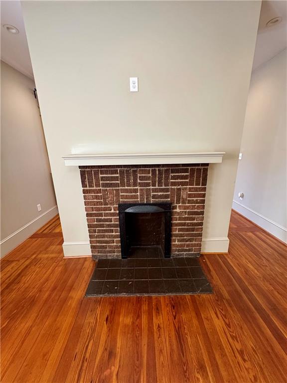 2482 Maple Street East Point, GA 30344 - Photo 13 of 39 a view of a livingroom with wooden floor and staircase