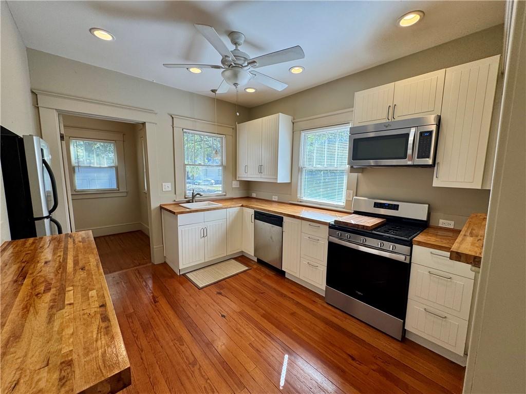 2482 Maple Street East Point, GA 30344 - Photo 15 of 39 a kitchen with stainless steel appliances granite countertop a sink and microwave