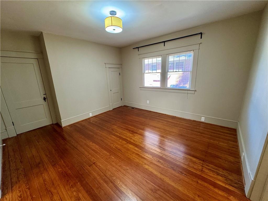 2482 Maple Street East Point, GA 30344 - Photo 20 of 39 an empty room with wooden floor and windows