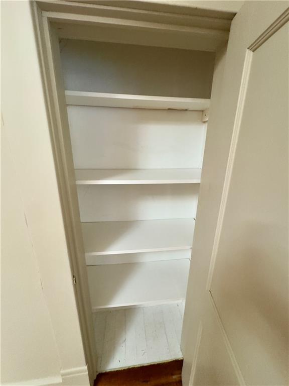 2482 Maple Street East Point, GA 30344 - Photo 22 of 39 a view of walk in closet with empty racks