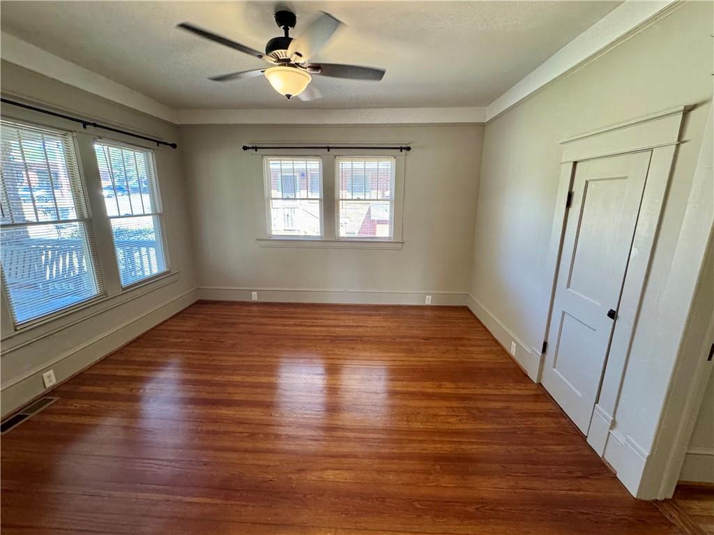 2482 Maple Street East Point, GA 30344 - Photo 27 of 39 wooden floor in an empty room with a window