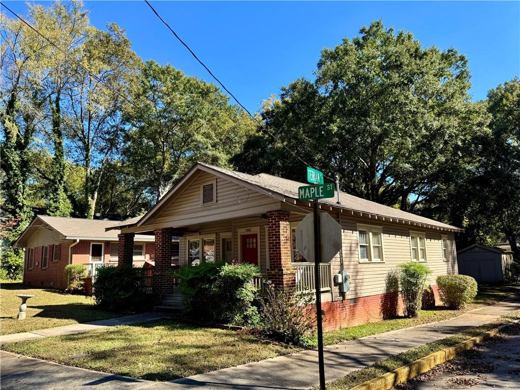 2482 Maple Street East Point, GA 30344 - Photo 32 of 39 a front view of a house with a yard