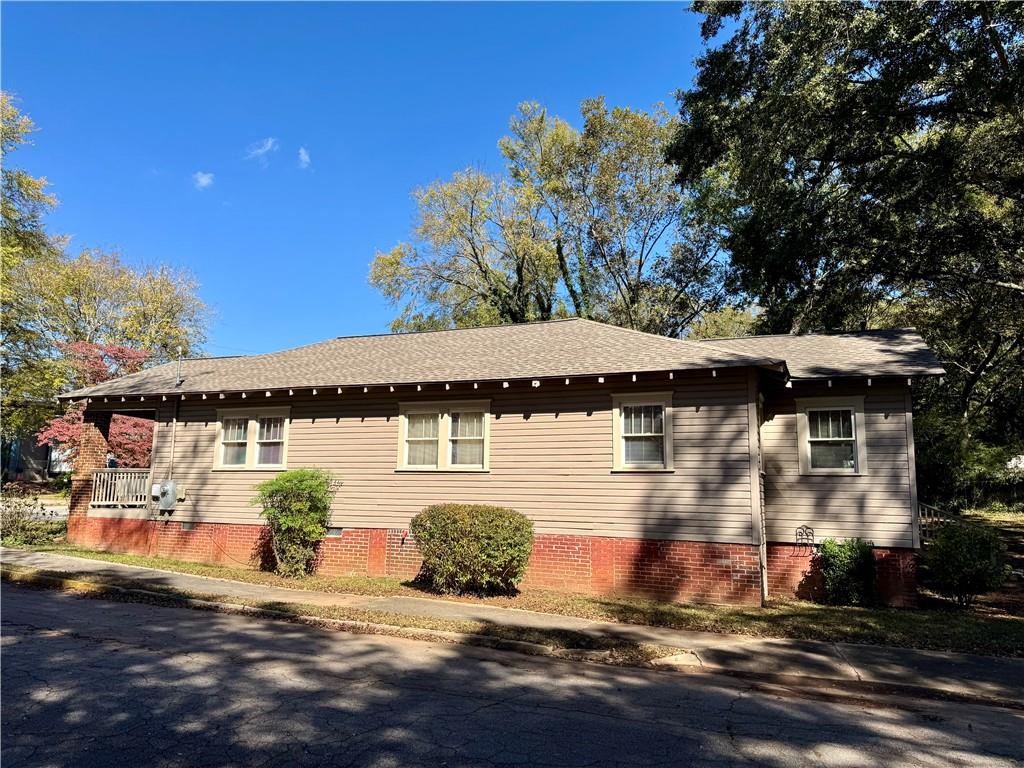 2482 Maple Street East Point, GA 30344 - Photo 34 of 39 a front view of a house with a yard