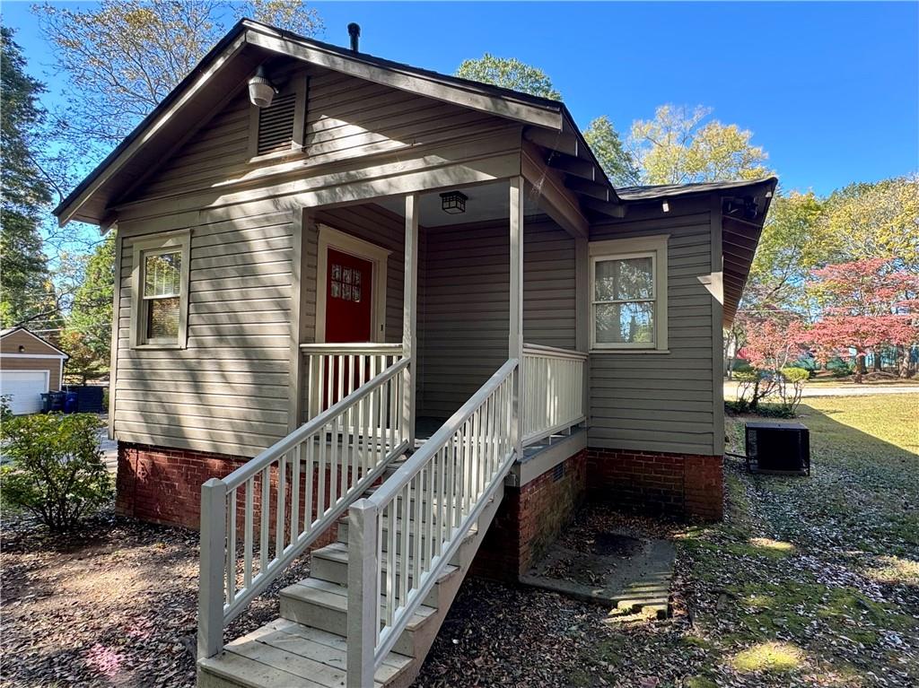 2482 Maple Street East Point, GA 30344 - Photo 35 of 39 a view of a house with wooden fence and two windows