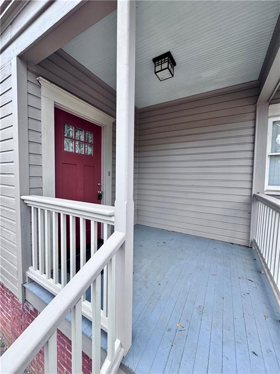 2482 Maple Street East Point, GA 30344 - Photo 36 of 39 a view of a porch with wooden floor and stairs