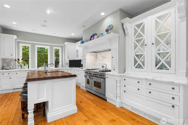 a kitchen with stainless steel appliances granite countertop a stove and a sink
