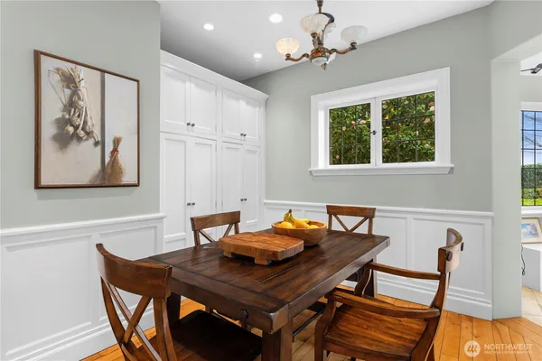 a view of a dining room with furniture window and wooden floor