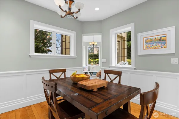 a view of a dining room with furniture window and wooden floor