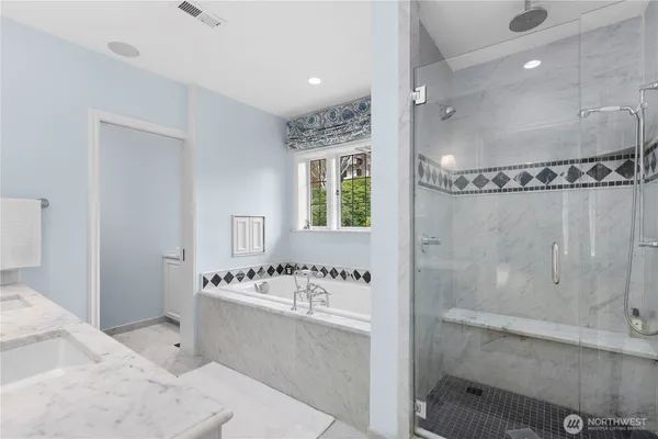 a bathroom with a bathtub and a sink