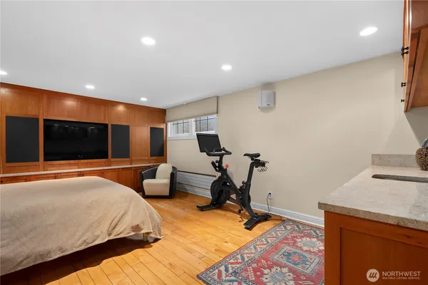 a bedroom with a bed and a flat screen tv