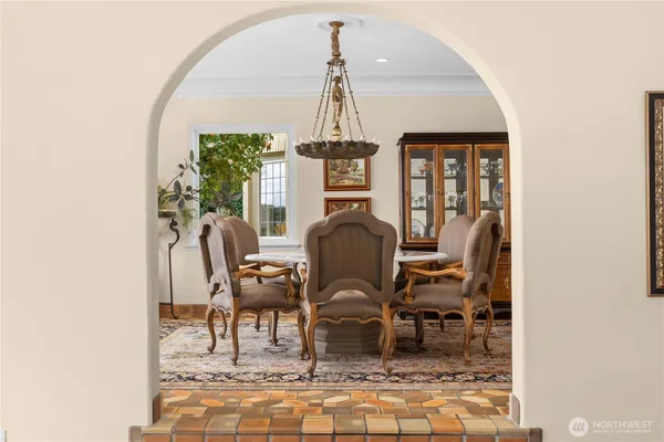a view of a dining room with furniture and window