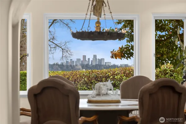 a view of a dining room with furniture and a chandelier