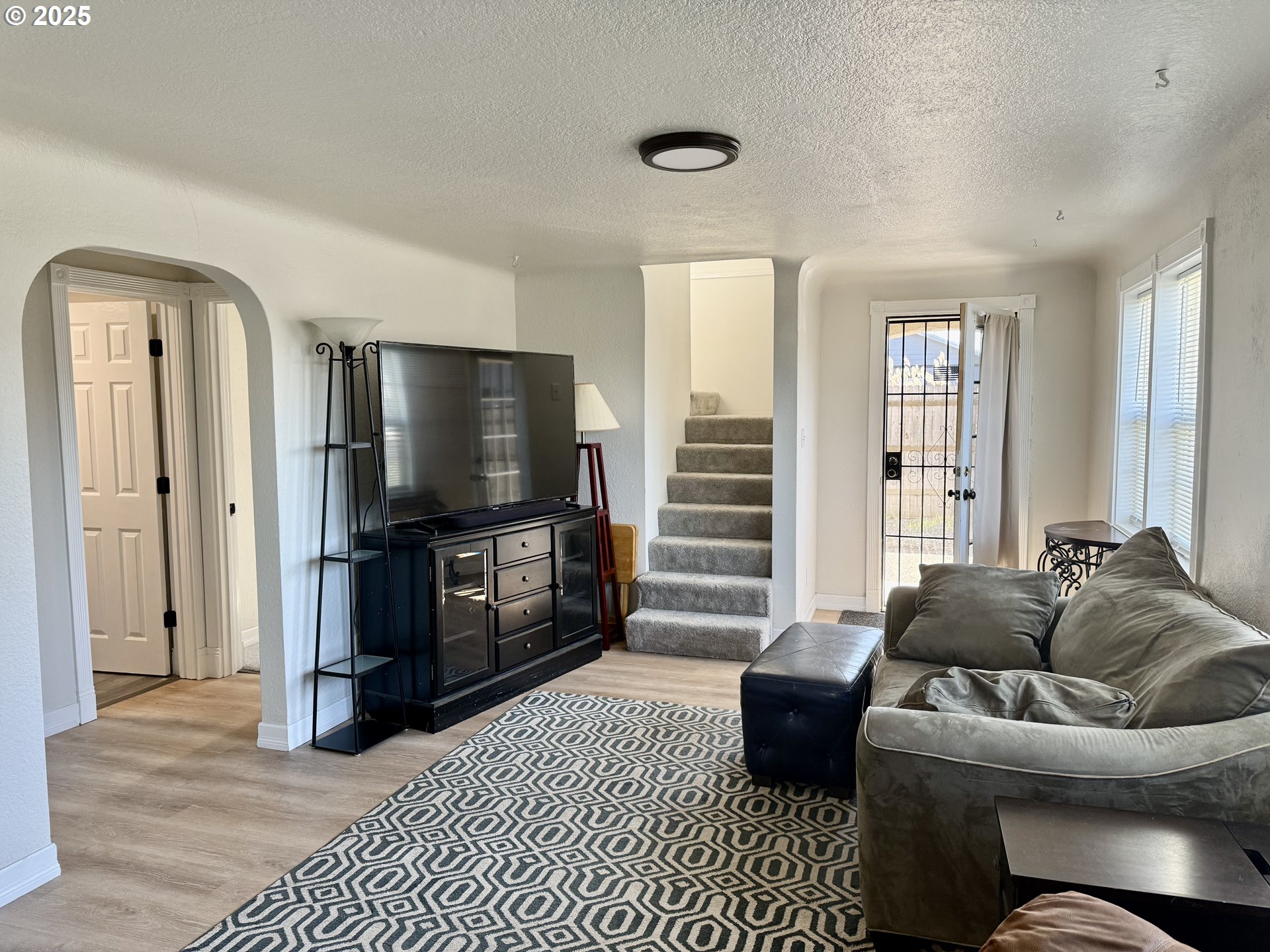 345 38th Street Springfield, OR 97478 - Photo 12 of 29 a living room with furniture and a flat screen tv