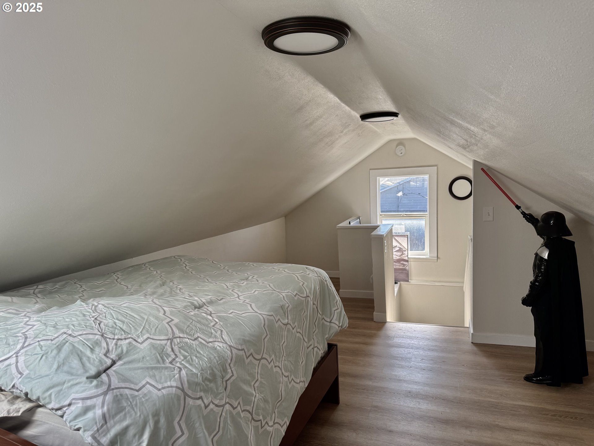 345 38th Street Springfield, OR 97478 - Photo 18 of 29 a bedroom with a bed and a chandelier